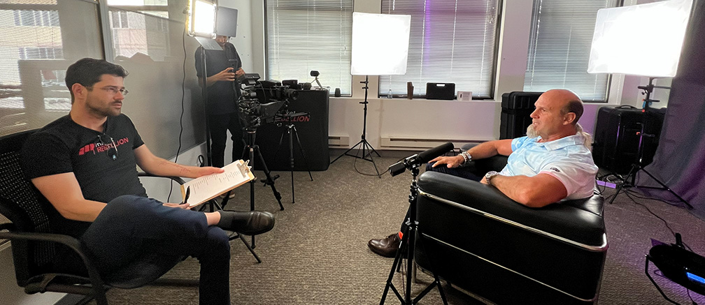 Jared (left) directing an interview with Pete Najarian (right)